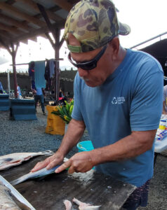 Uncle Mac Cutting a Fish